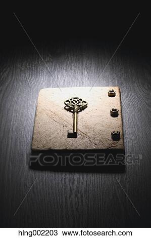 Stock Image - Vintage key and book. Fotosearch