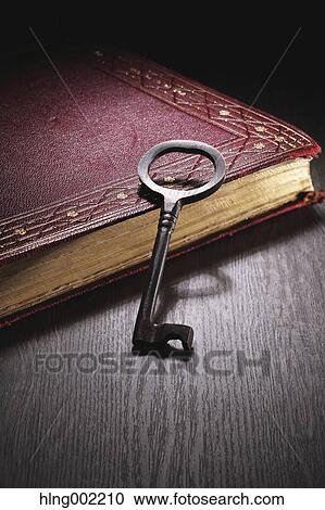 Vintage key and book View Large Photo Image Stock Image - Vintage key and book. Fotosearch