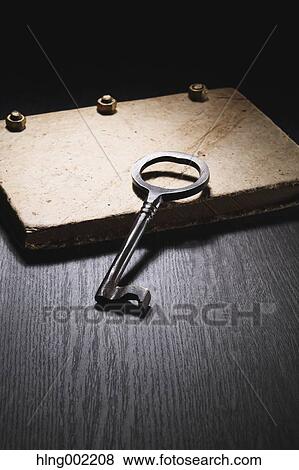 Stock Photo - Vintage key and book. Fotosearch