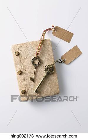 Stock Image - Vintage keys and book. Fotosearch
