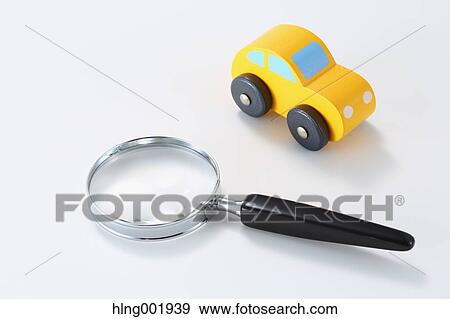 Wooden toy car and magnifying glass View Large Photo Image Stock Photo - Wooden toy car and magnifying glass. Fotosearch