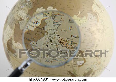 World globe and magnifying glass View Large Photo Image Stock Image - World globe and magnifying glass. Fotosearch