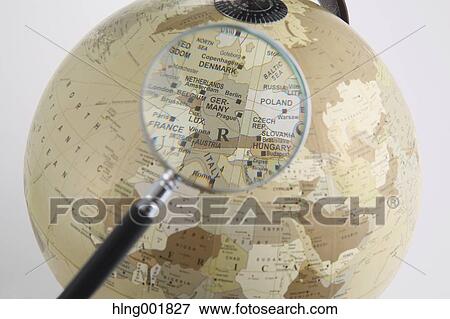 World globe and magnifying glass View Large Photo Image Stock Photo - World globe and magnifying glass. Fotosearch