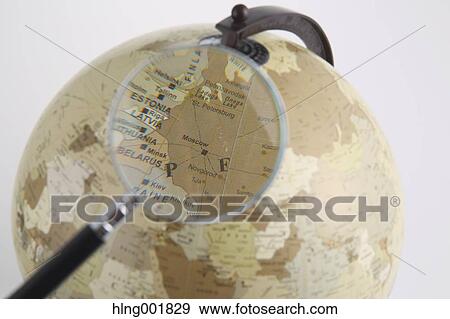 World globe and magnifying glass View Large Photo Image Stock Photo - World globe and magnifying glass. Fotosearch