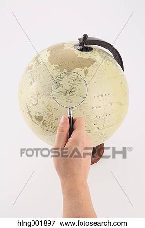 World globe and magnifying glass View Large Photo Image Stock Photo - World globe and magnifying glass. Fotosearch