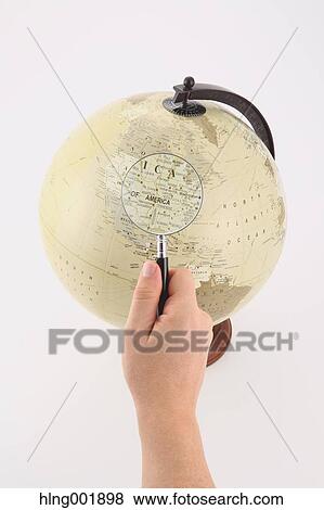 World globe and magnifying glass View Large Photo Image Stock Photo - World globe and magnifying glass. Fotosearch