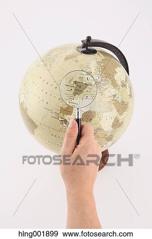 World globe and magnifying glass View Large Photo Image Stock Photo - World globe and magnifying glass. Fotosearch