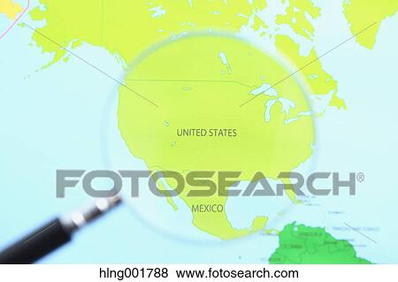 Stock Photo - World map and magnifying glass. Fotosearch