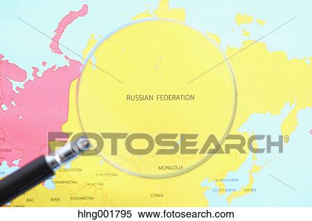 Stock Photography - World map and magnifying glass. Fotosearch