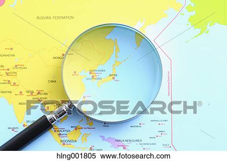 Stock Photography - World map and magnifying glass. Fotosearch