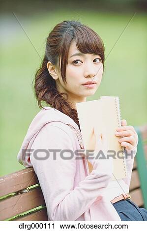 Stock Image - Young attractive Japanese female University student portrait. Fotosearch