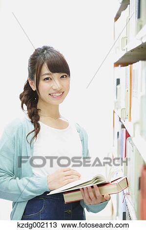 Stock Image - Young attractive Japanese female University student portrait. Fotosearch