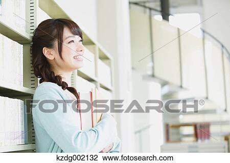 Stock Image - Young attractive Japanese female University student portrait. Fotosearch