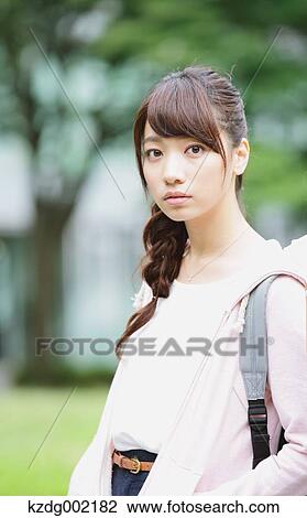 Stock Image - Young attractive Japanese female University student portrait. Fotosearch
