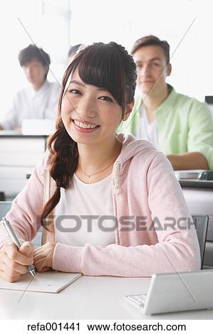 Stock Image - Young attractive Japanese female University student portrait. Fotosearch