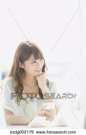Stock Photo - Young attractive Japanese female University student portrait. Fotosearch