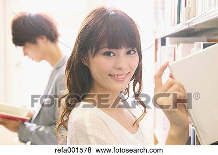 Stock Photo - Young attractive Japanese female University student portrait. Fotosearch