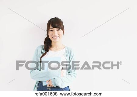 Stock Photo - Young attractive Japanese female University student portrait. Fotosearch