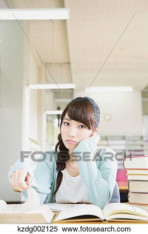 Stock Photography - Young attractive Japanese female University student portrait. Fotosearch