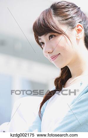 Stock Photography - Young attractive Japanese female University student portrait. Fotosearch
