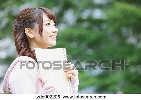 Stock Photography - Young attractive Japanese female University student portrait. Fotosearch