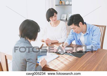 Young Japanese couple consulting with financial planner View Large Photo Image Picture - Young Japanese couple consulting with financial planner. Fotosearch