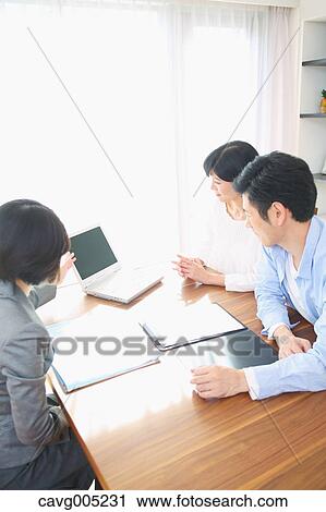 Young Japanese couple consulting with financial planner View Large Photo Image Stock Image - Young Japanese couple consulting with financial planner. Fotosearch