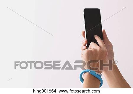 Young Japanese man using smartphone View Large Photo Image Picture - Young Japanese man using smartphone. Fotosearch