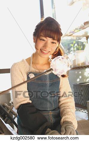 Young Japanese woman enjoying glass crafting workshop in Kawagoe, Japan View Large Photo Image Stock Image - Young Japanese woman enjoying glass crafting workshop in Kawagoe, Japan. Fotosearch