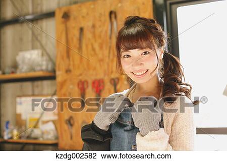 Young Japanese woman enjoying glass crafting workshop in Kawagoe, Japan View Large Photo Image Stock Image - Young Japanese woman enjoying glass crafting workshop in Kawagoe, Japan. Fotosearch
