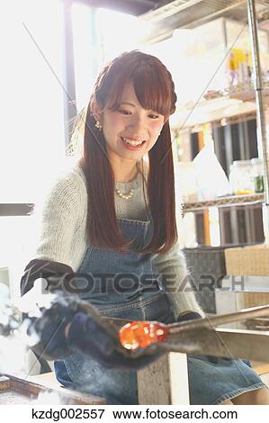 Young Japanese woman enjoying glass crafting workshop in Kawagoe, Japan View Large Photo Image Stock Photo - Young Japanese woman enjoying glass crafting workshop in Kawagoe, Japan. Fotosearch