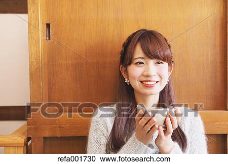 Young Japanese woman enjoying Maccha green tea in Kawagoe, Japan View Large Photo Image Stock Image - Young Japanese woman enjoying Maccha green tea in Kawagoe, Japan. Fotosearch
