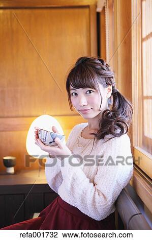 Young Japanese woman enjoying Maccha green tea in Kawagoe, Japan View Large Photo Image Stock Image - Young Japanese woman enjoying Maccha green tea in Kawagoe, Japan. Fotosearch