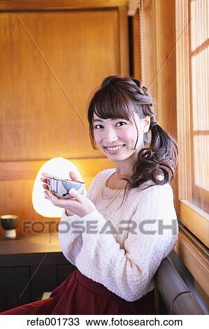 Young Japanese woman enjoying Maccha green tea in Kawagoe, Japan View Large Photo Image Stock Image - Young Japanese woman enjoying Maccha green tea in Kawagoe, Japan. Fotosearch