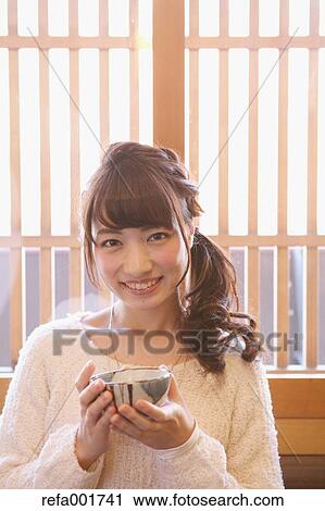 Young Japanese woman enjoying Maccha green tea in Kawagoe, Japan View Large Photo Image Stock Image - Young Japanese woman enjoying Maccha green tea in Kawagoe, Japan. Fotosearch