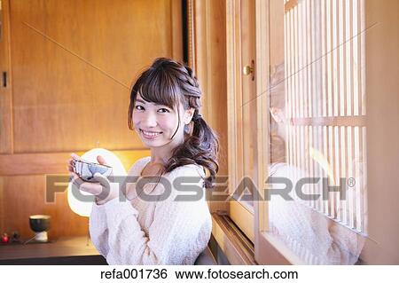 Young Japanese woman enjoying Maccha green tea in Kawagoe, Japan View Large Photo Image Stock Photograph - Young Japanese woman enjoying Maccha green tea in Kawagoe, Japan. Fotosearch