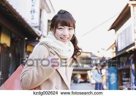 Young Japanese woman enjoying trip in Kawagoe, Japan View Large Photo Image Picture - Young Japanese woman enjoying trip in Kawagoe, Japan. Fotosearch