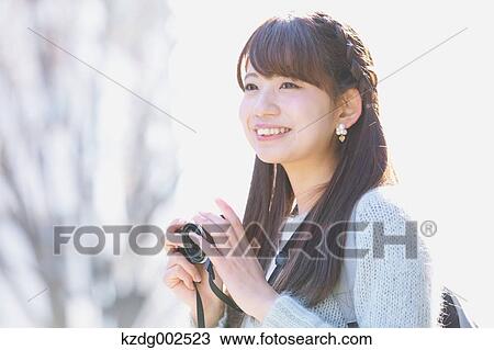 Stock Image - Young Japanese woman enjoying trip in Kawagoe, Japan. Fotosearch