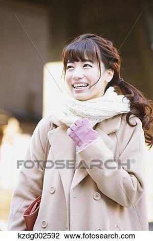 Stock Image - Young Japanese woman enjoying trip in Kawagoe, Japan. Fotosearch