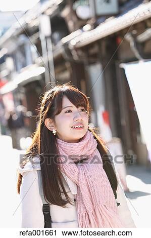 Stock Image - Young Japanese woman enjoying trip in Kawagoe, Japan. Fotosearch