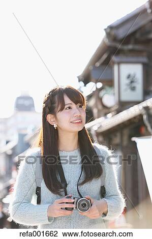 Young Japanese woman enjoying trip in Kawagoe, Japan View Large Photo Image Stock Image - Young Japanese woman enjoying trip in Kawagoe, Japan. Fotosearch