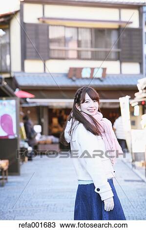 Stock Image - Young Japanese woman enjoying trip in Kawagoe, Japan. Fotosearch