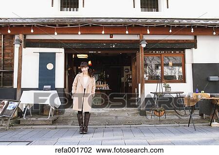 Stock Image - Young Japanese woman enjoying trip in Kawagoe, Japan. Fotosearch