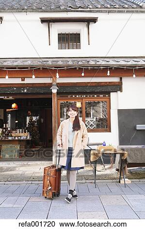 Young Japanese woman enjoying trip in Kawagoe, Japan View Large Photo Image Stock Image - Young Japanese woman enjoying trip in Kawagoe, Japan. Fotosearch