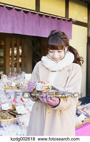 Young Japanese woman enjoying trip in Kawagoe, Japan View Large Photo Image Stock Photo - Young Japanese woman enjoying trip in Kawagoe, Japan. Fotosearch
