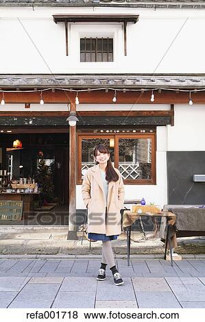 Stock Photo - Young Japanese woman enjoying trip in Kawagoe, Japan. Fotosearch