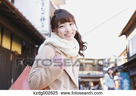 Young Japanese woman enjoying trip in Kawagoe, Japan View Large Photo Image Stock Photography - Young Japanese woman enjoying trip in Kawagoe, Japan. Fotosearch