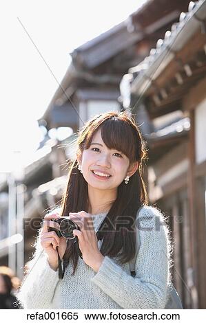 Young Japanese woman enjoying trip in Kawagoe, Japan View Large Photo Image Stock Photography - Young Japanese woman enjoying trip in Kawagoe, Japan. Fotosearch
