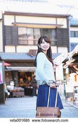 Young Japanese woman enjoying trip in Kawagoe, Japan View Large Photo Image Stock Photography - Young Japanese woman enjoying trip in Kawagoe, Japan. Fotosearch