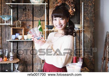Young Japanese woman enjoying visit to glass workshop in Kawagoe, Japan View Large Photo Image Stock Image - Young Japanese woman enjoying visit to glass workshop in Kawagoe, Japan. Fotosearch